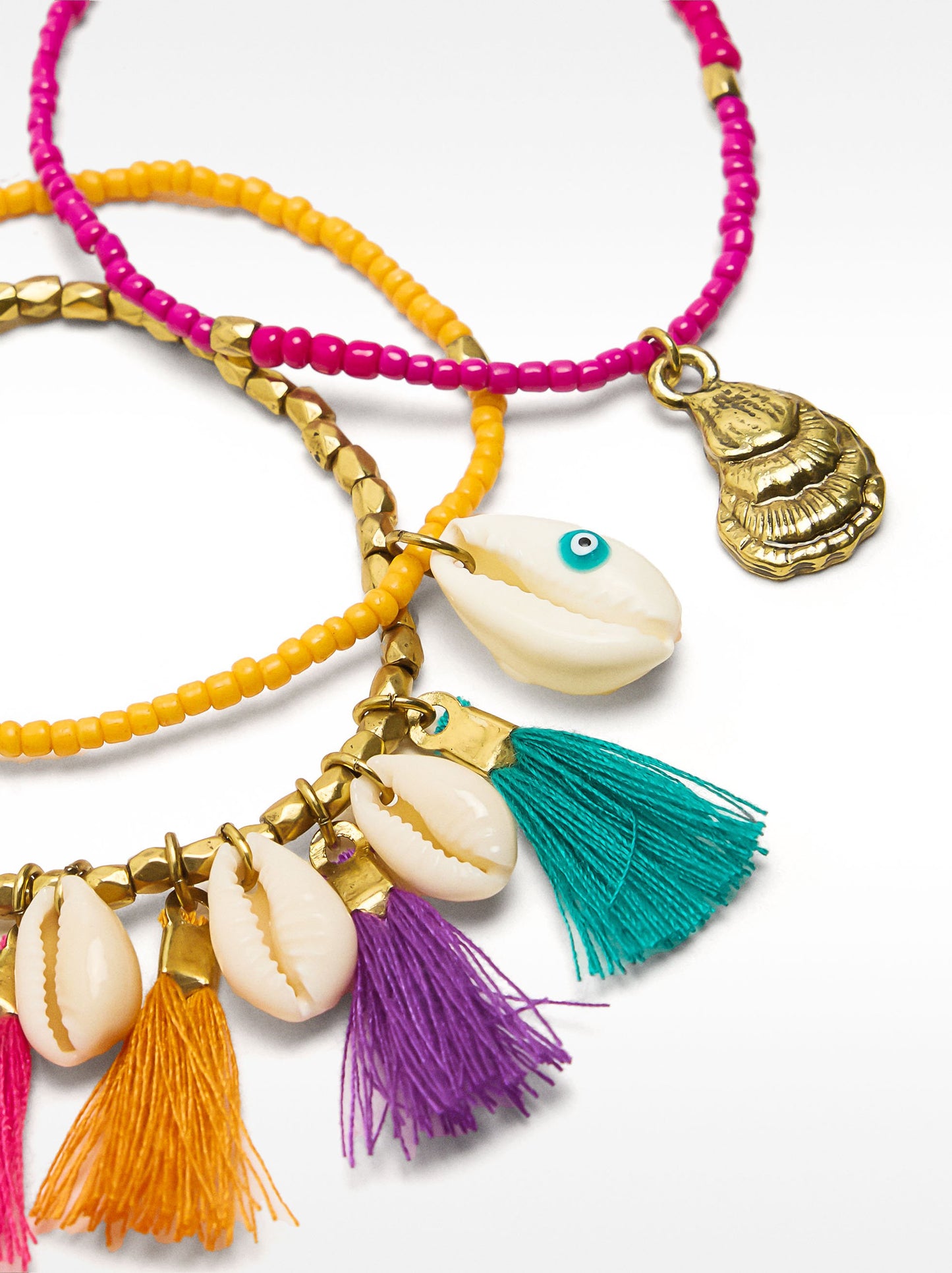 Set Of Elastic Bracelets With Multicolor Tassels