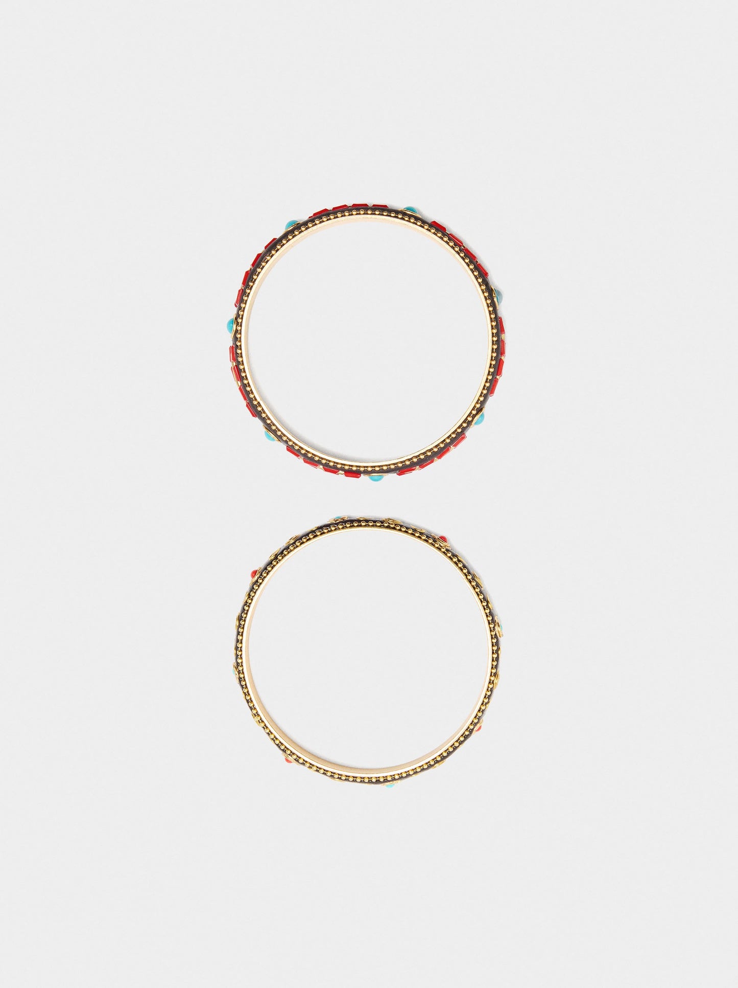 Set Of Rigid Bracelets With Colour Details