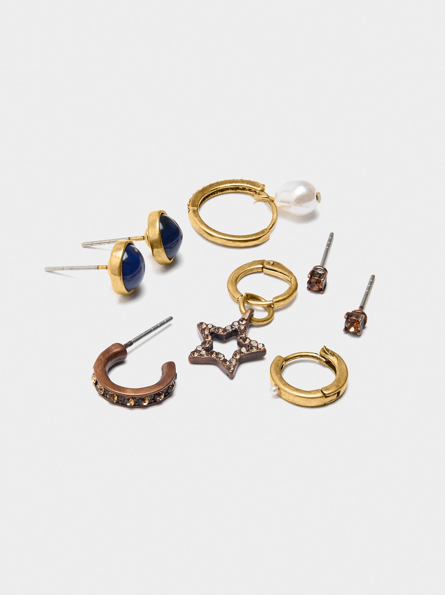 Set Of Earrings With Star And Pearl