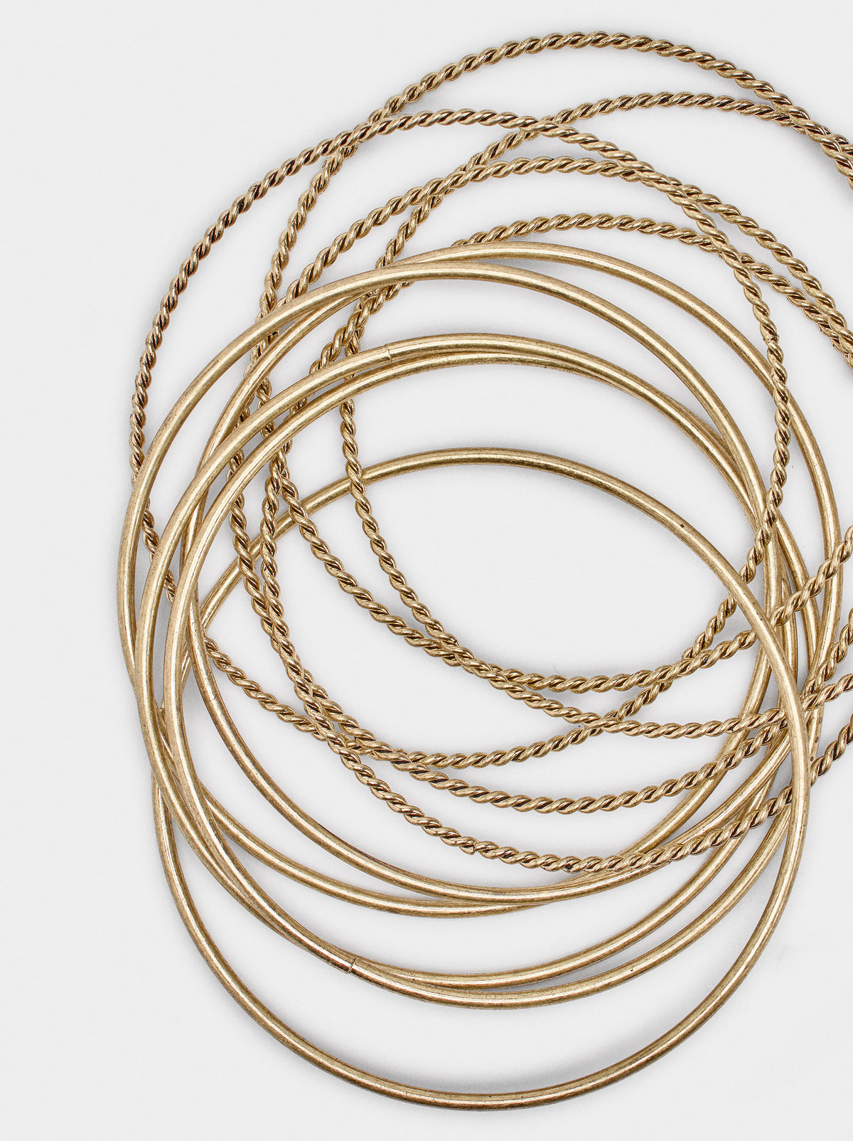 Set Of Bracelets With Smooth And Braided Designs