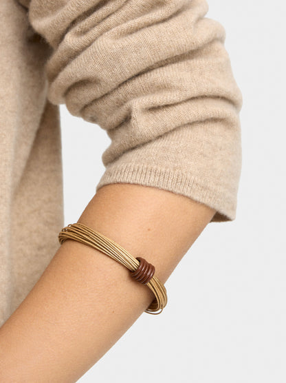 Rigid Bracelets With Criss-Cross Design