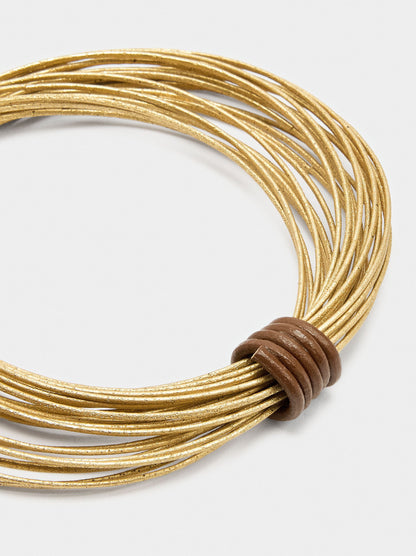 Rigid Bracelets With Criss-Cross Design