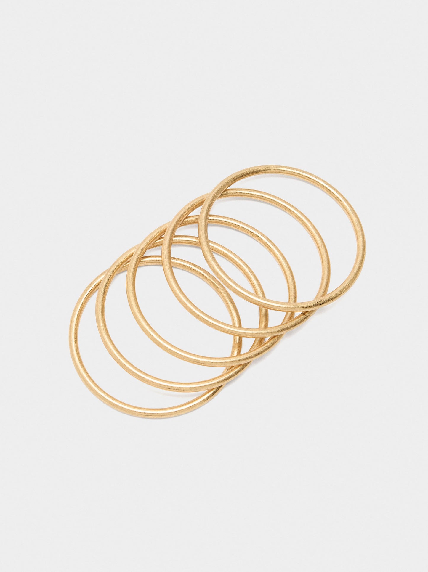 Set Of Five Rigid Golden Bracelets