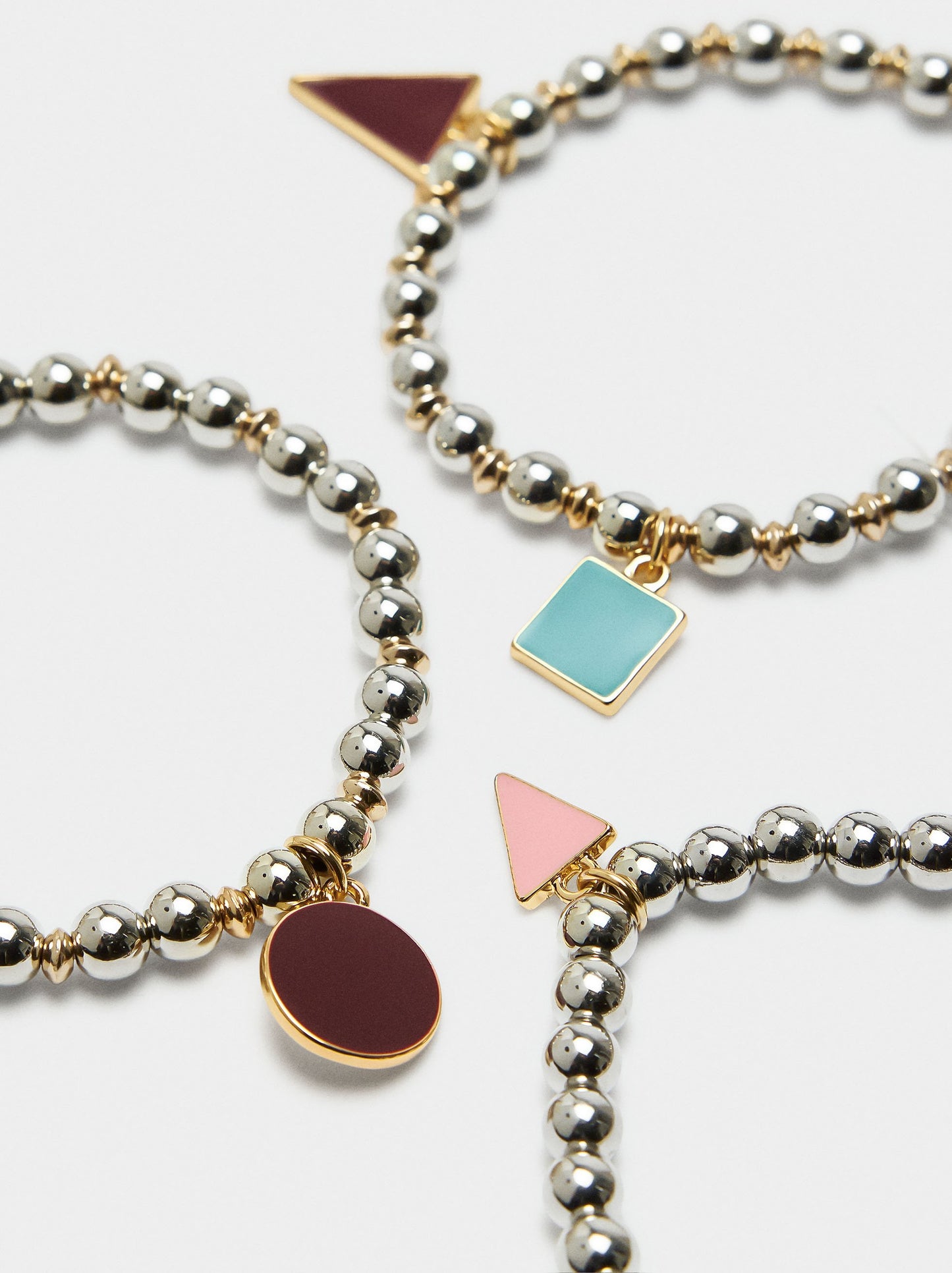 Set Of Elastic Bracelets With Charms