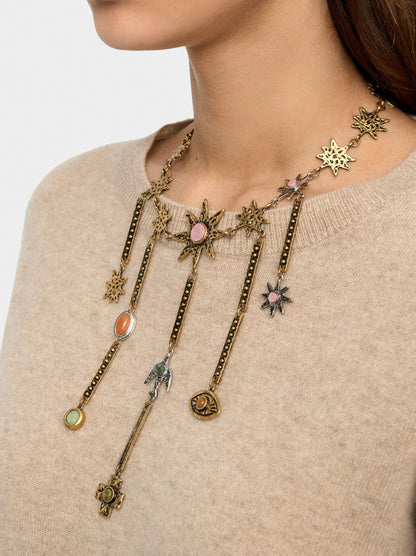 Necklace With Star Pendants Hanging From Bars