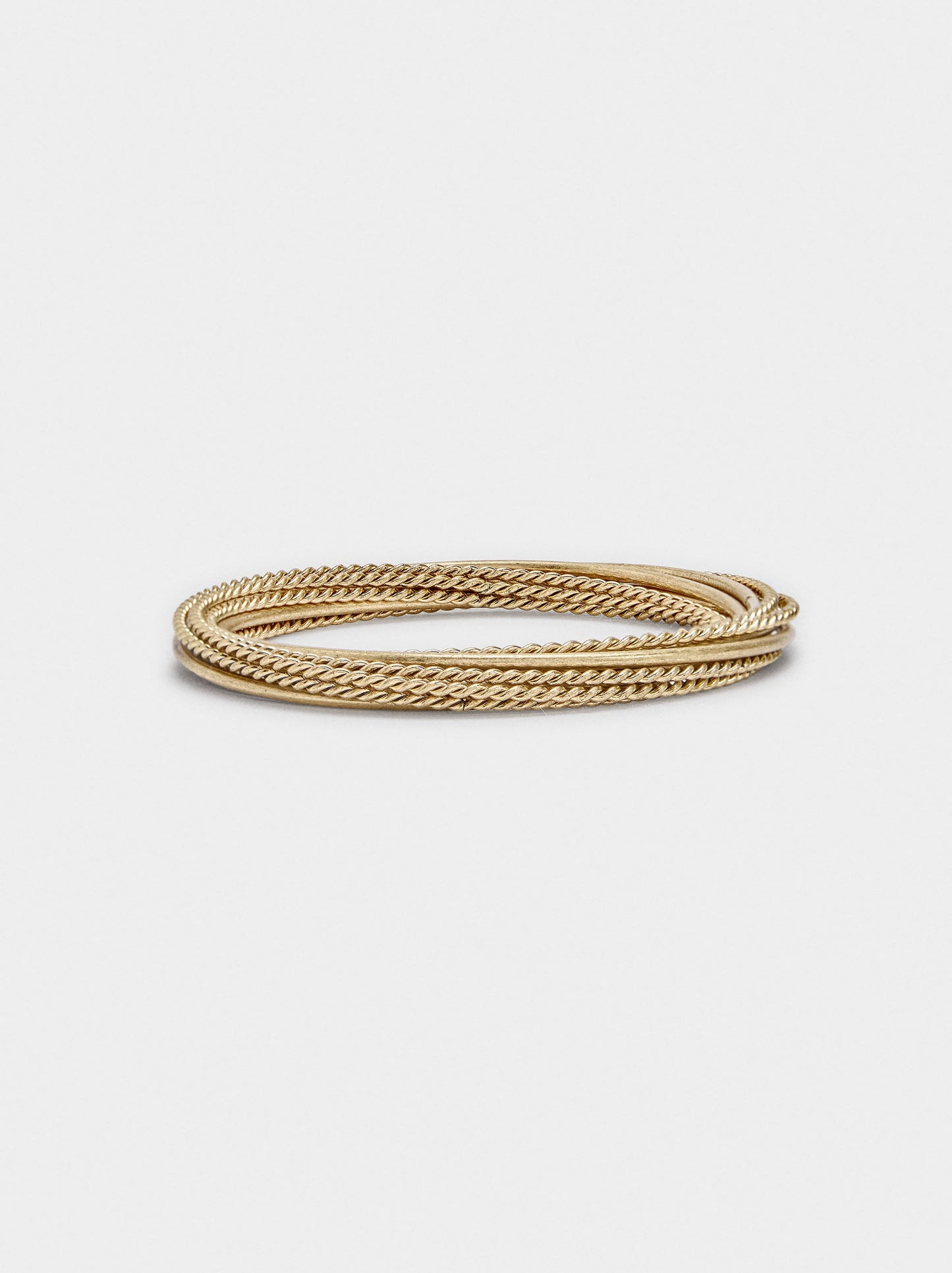 Set Of Bracelets With Smooth And Braided Designs