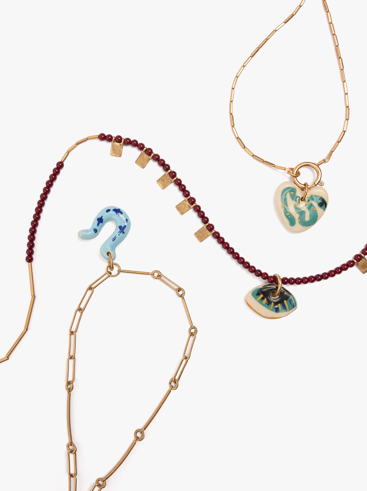 Set Of Three Necklaces With Ceramic Pendants