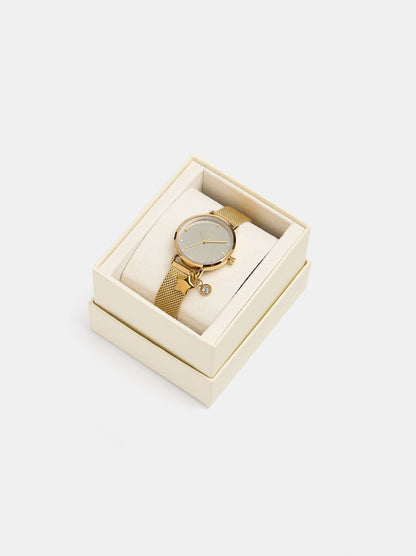 Round Watch With A Steel Mesh Strap And Charm