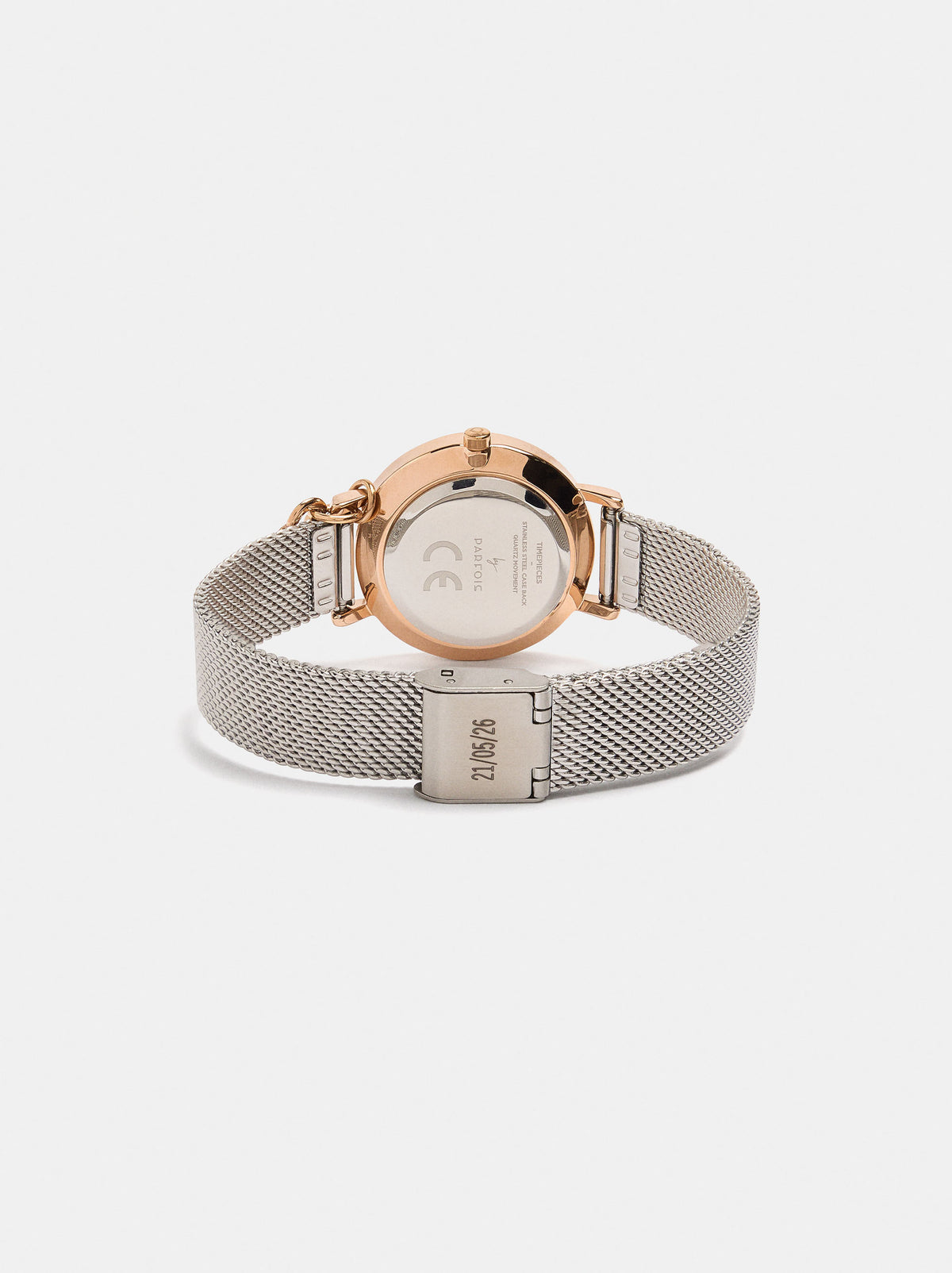 Round Watch With A Steel Mesh Strap And Charm