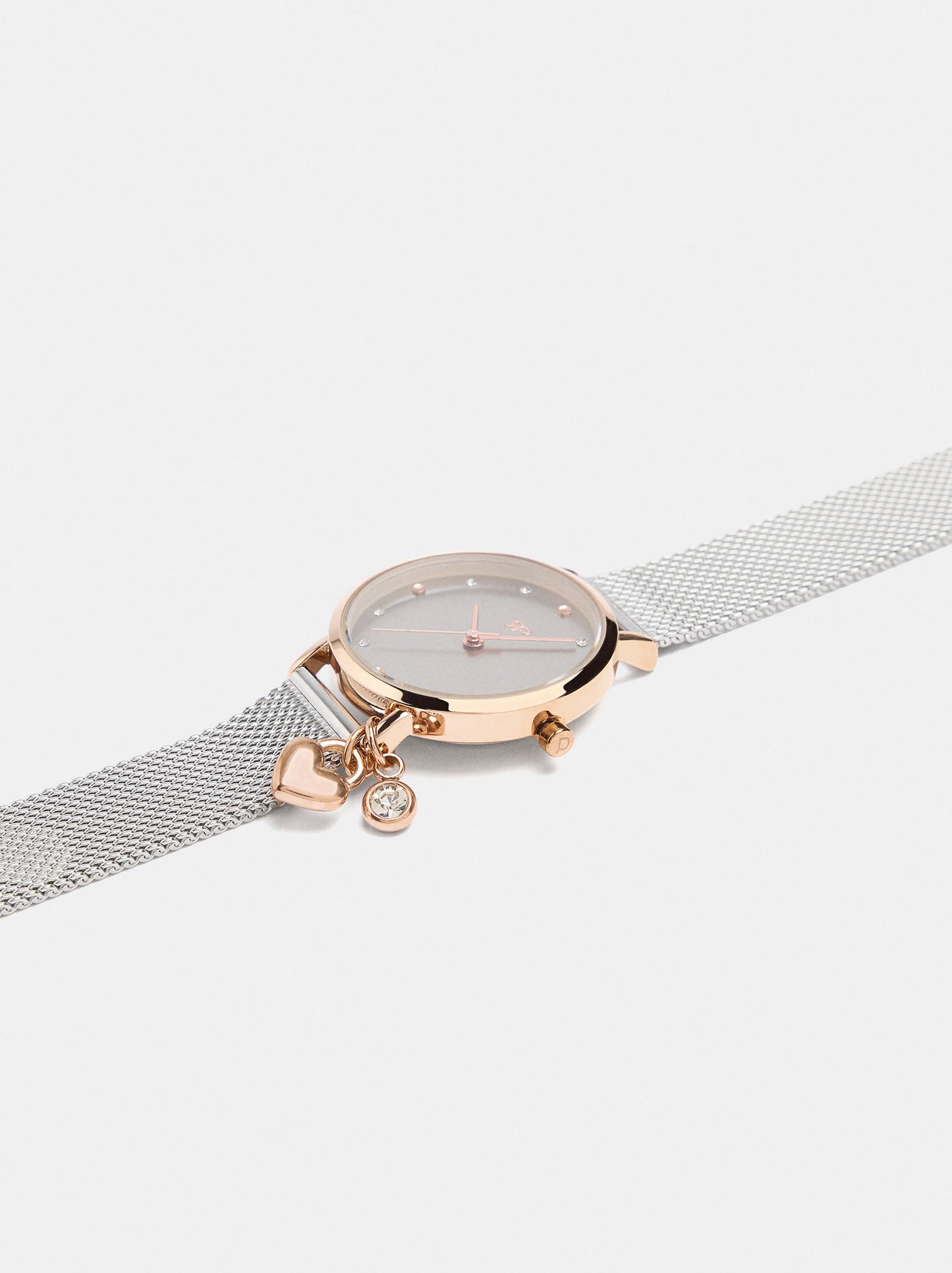 Round Watch With A Steel Mesh Strap And Charm