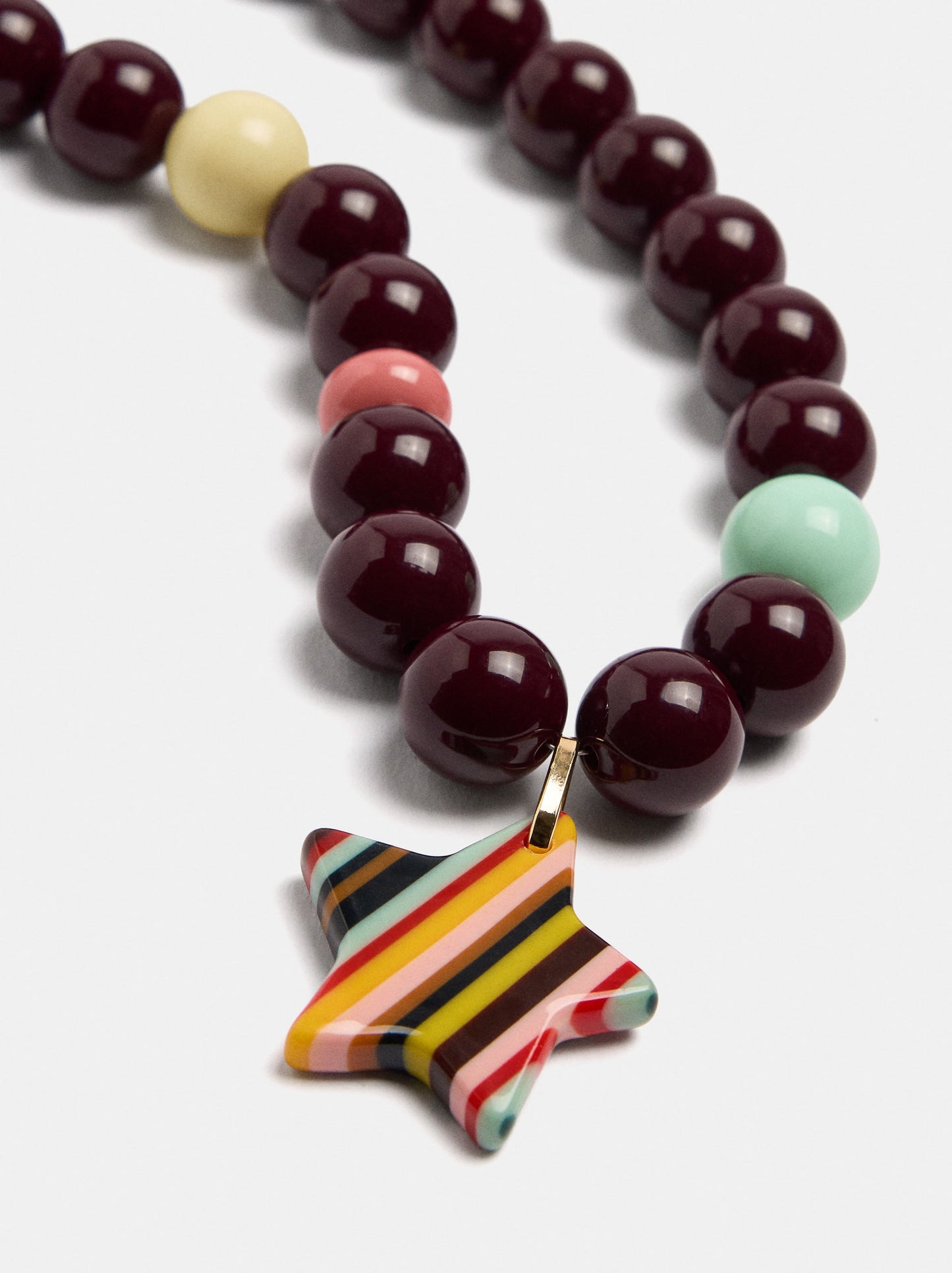 Beaded Necklace With A Striped Star Pendant