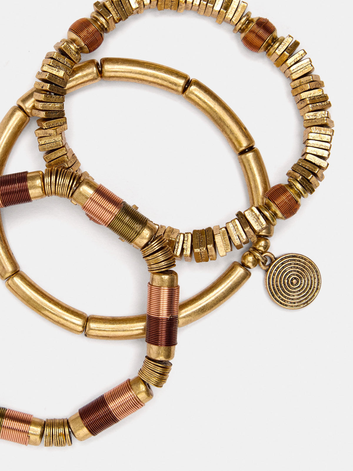 Set Of Elasticated Bracelets With Beads And Medal